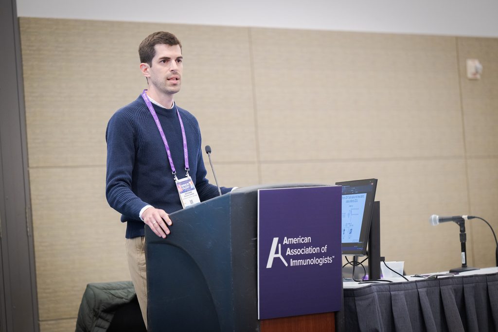 Presenter at a podium giving a talk